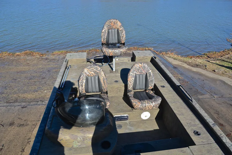 Slide: The Image of 2016 G3 Eagle 176 boat with camo seats by the water. - 21