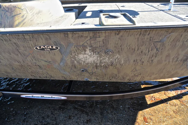 Slide: The Image of 2016 G3 Eagle 176 boat with camouflage design and visible scratches on the side. - 27