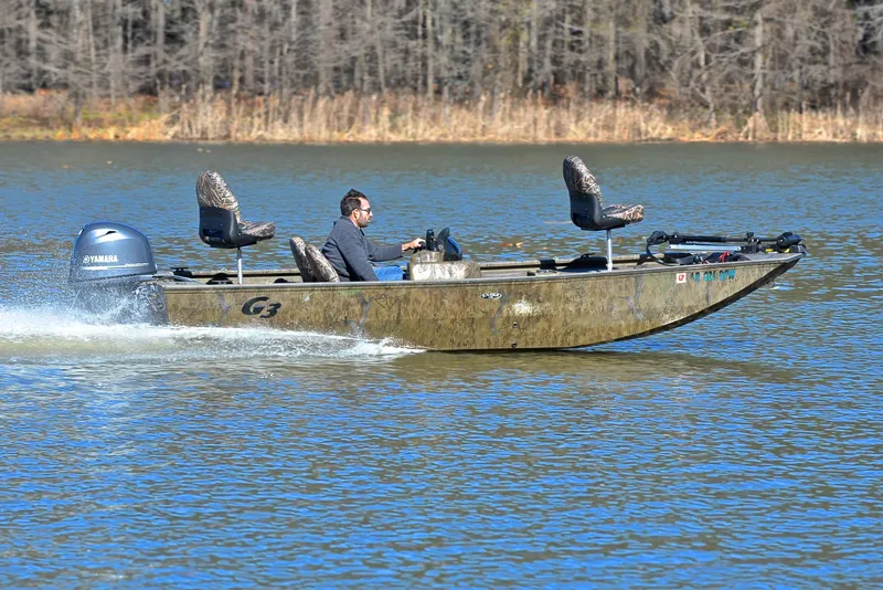 Slide: The Image of 2016 G3 Eagle 176 boat speeding on a lake with a Yamaha outboard motor. - 3