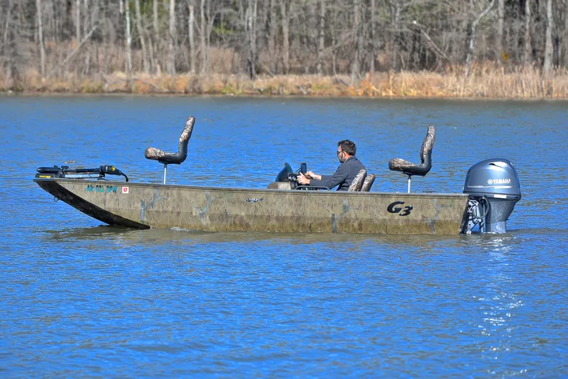 Slide: The Image of 2016 G3 Eagle 176 boat on a lake with a person driving. - 9