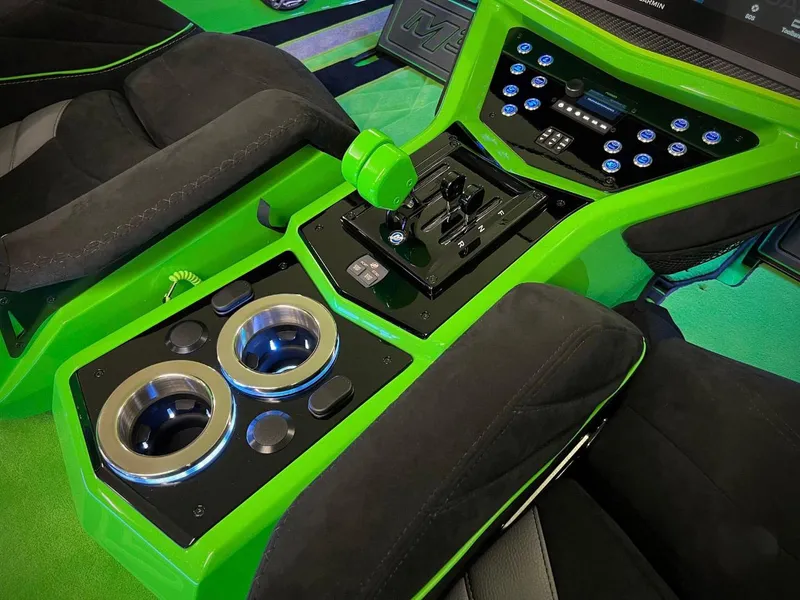 Slide: The Image of Interior of 2023 Daves Custom Boats M37R, featuring green accents and modern controls. - 10
