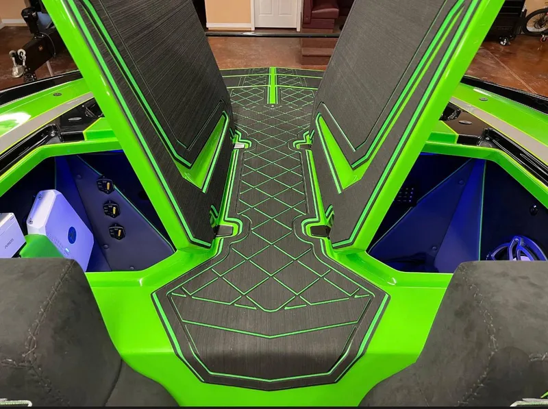 Slide: The Image of 2023 Daves Custom Boats M37R interior with vibrant green and black design. - 13
