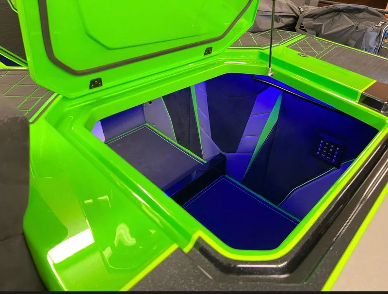 Slide: The Image of 2023 Daves Custom Boats M37R, vibrant green storage compartment with blue interior lighting. - 14