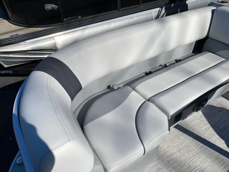 Slide: The Image of 2025 SunCatcher Select 322RC boat interior with gray seating and modern design. - 12