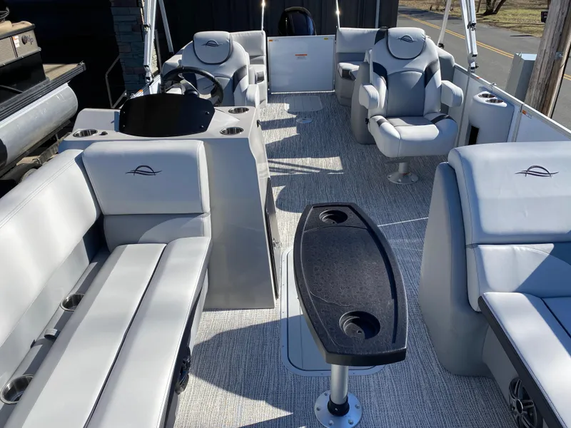 Slide: The Image of 2025 SunCatcher Select 322RC pontoon boat interior with plush seating and modern design. - 13