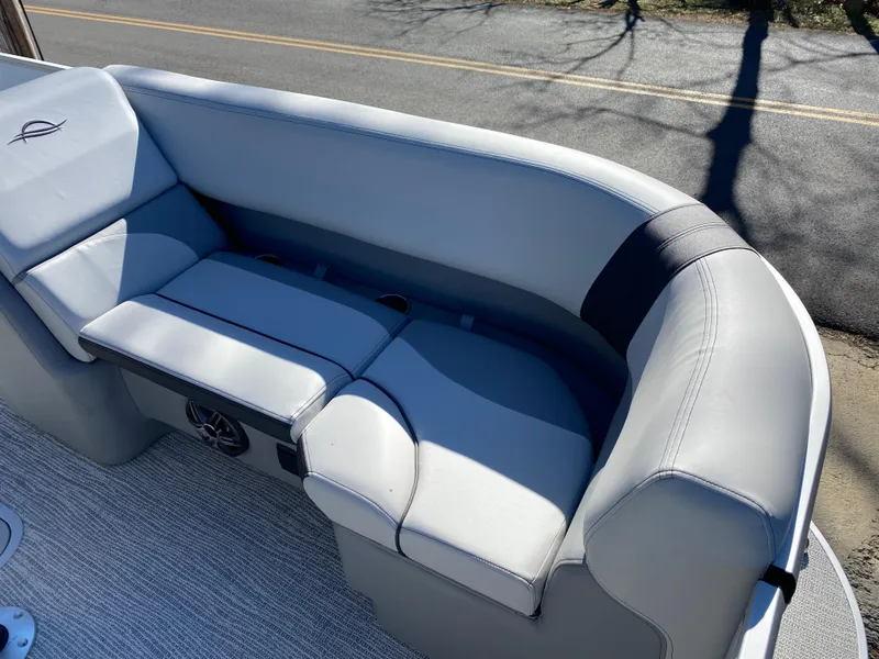 Slide: The Image of Luxurious seating on 2025 SunCatcher Select 322RC pontoon boat, featuring sleek gray upholstery. - 14