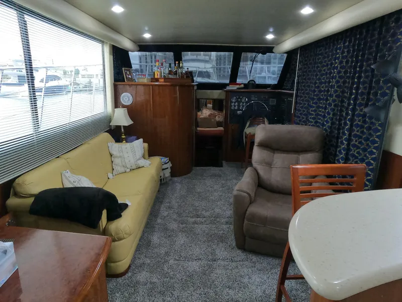 Slide: The Image of Interior of 2006 Bluewater Yachts 5200, featuring cozy seating and elegant decor. - 29