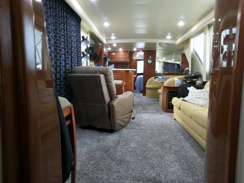 Slide: The Image of Interior of 2006 Bluewater Yachts 5200, featuring plush seating and modern amenities. - 35