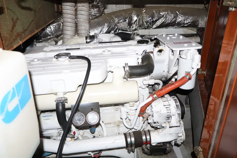 Slide: The Image of Engine room of 2006 Bluewater Yachts 5200, showcasing mechanical components and wiring. - 42