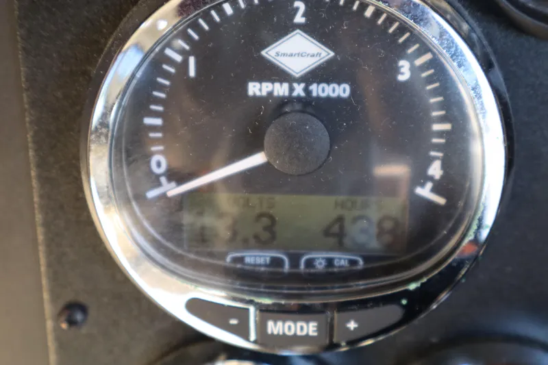 Slide: The Image of Close-up of a 2006 Bluewater Yachts 5200 tachometer displaying RPM and mode settings. - 43