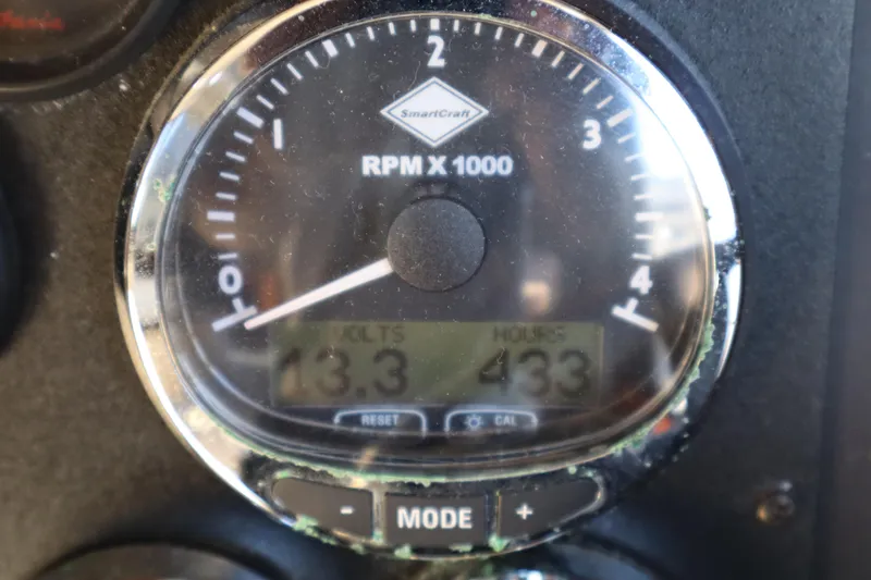 Slide: The Image of Close-up of 2006 Bluewater Yachts 5200 RPM gauge displaying 13.3 volts and 433 hours. - 44