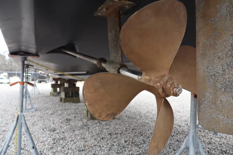Slide: The Image of Propeller of 2006 Bluewater Yachts 5200 on dry dock, showcasing marine engineering. - 48