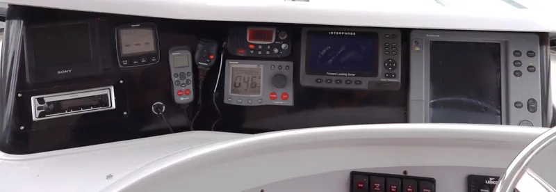 Slide: The Image of Control panel of a 2006 Bluewater Yachts 5200, featuring navigation and communication equipment. - 8