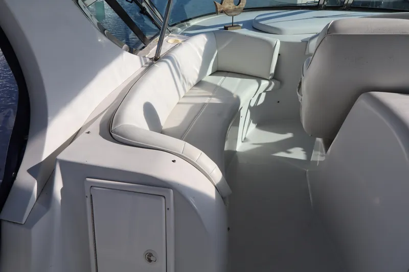 Slide: The Image of 2006 Bluewater Yachts 5200 interior with white seating and sleek design. - 9