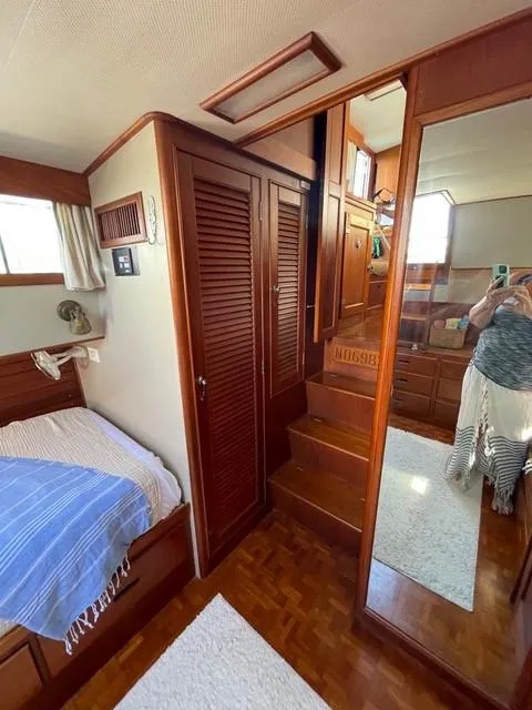 Slide: The Image of Interior of 1986 Grand Banks 42 Classic yacht with wooden finishes and cozy cabin space. - 16