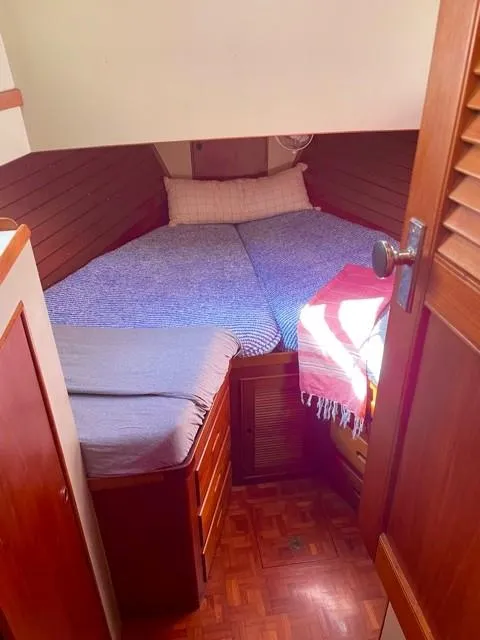 Slide: The Image of Cozy cabin interior of 1986 Grand Banks 42 Classic with wooden furnishings and bed. - 18