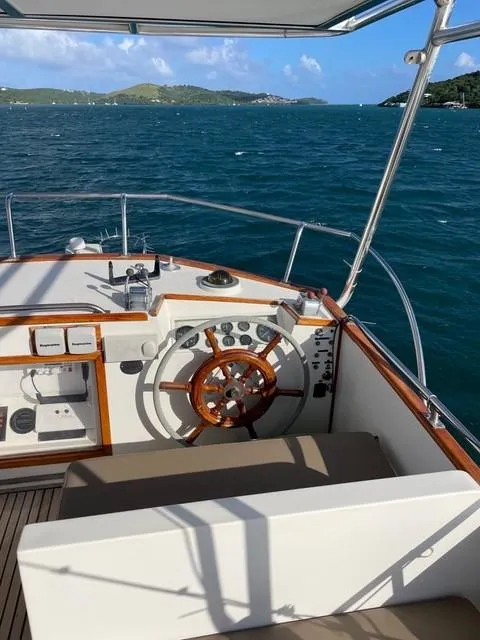 Slide: The Image of 1986 Grand Banks 42 Classic yacht helm with ocean view and distant islands. - 27