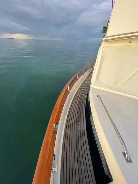 Slide: The Image of 1986 Grand Banks 42 Classic yacht on calm sea under cloudy sky. - 36