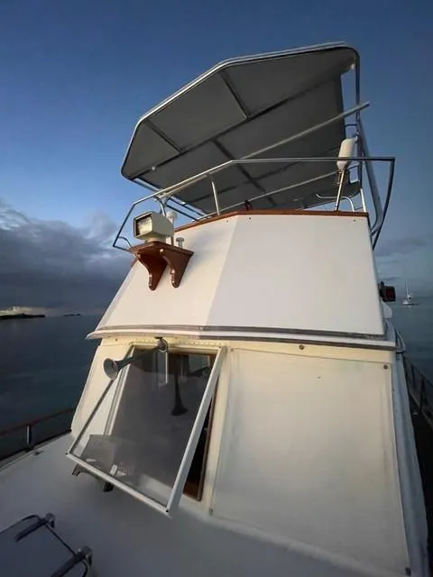 Slide: The Image of 1986 Grand Banks 42 Classic yacht with open window and sunshade. - 39