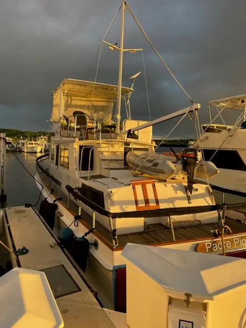 Slide: The Image of 1986 Grand Banks 42 Classic docked at sunset. - 40