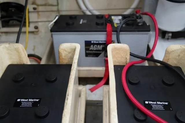 Slide: The Image of AGM battery setup on 1986 Grand Banks 42 Classic boat, featuring West Marine components. - 46