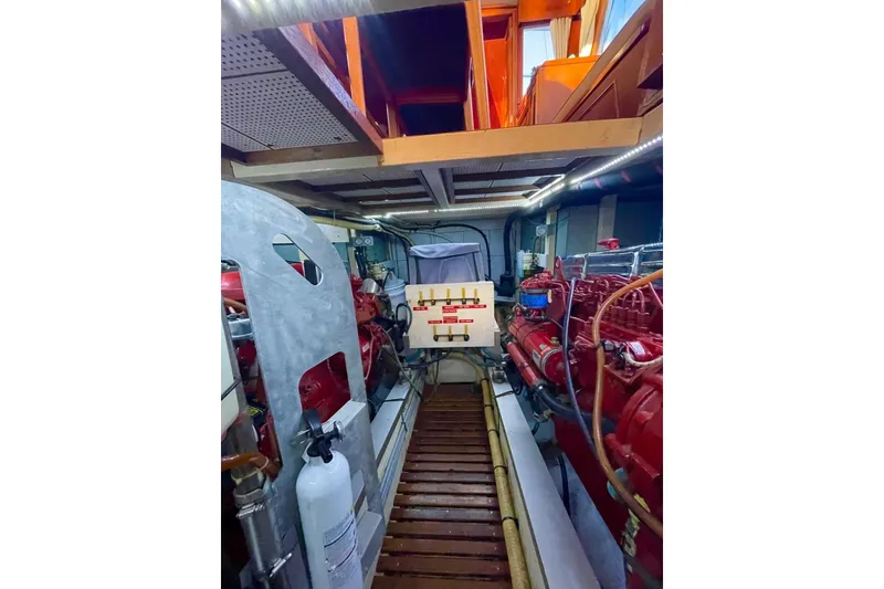 Slide: The Image of Engine room of 1986 Grand Banks 42 Classic yacht with visible machinery and equipment. - 50