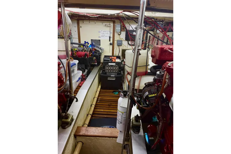 Slide: The Image of Engine room of 1986 Grand Banks 42 Classic yacht with equipment and tools. - 53