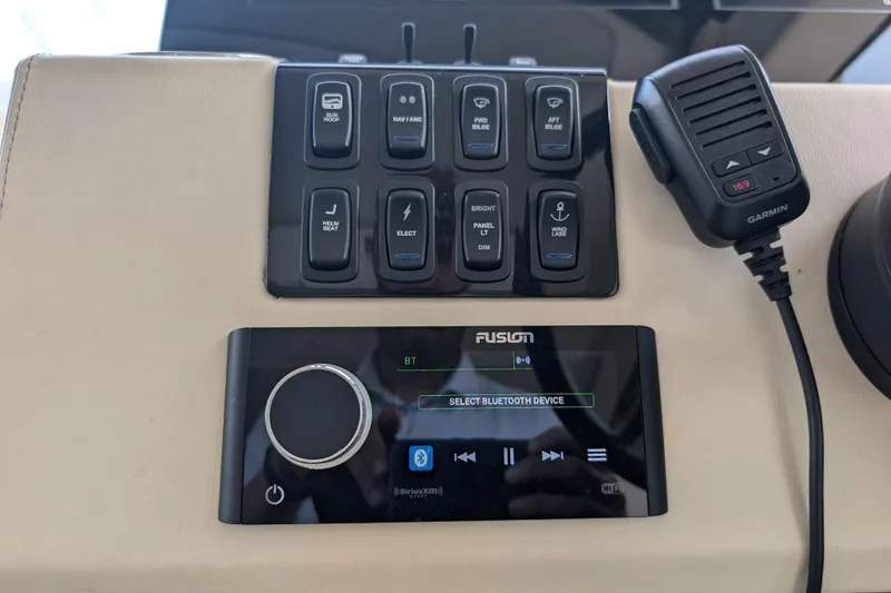 Slide: The Image of Control panel of 2020 Regal 38 Grande Coupe with Fusion audio system and Garmin microphone. - 18