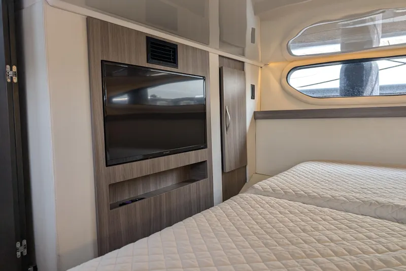 Slide: The Image of Interior of 2020 Regal 38 Grande Coupe with twin beds and wall-mounted TV. - 25