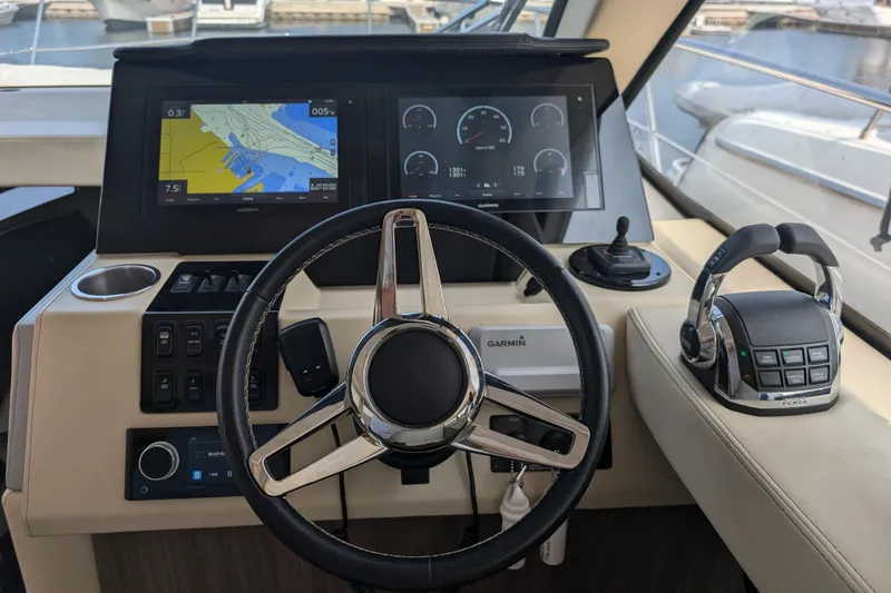 Slide: The Image of Helm of 2020 Regal 38 Grande Coupe with navigation screens and controls. - 4