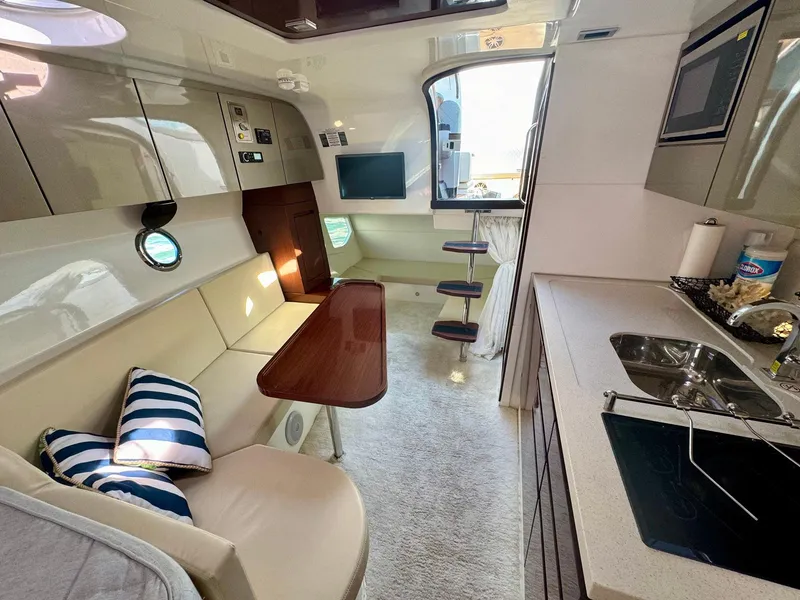 Slide: The Image of Luxurious interior of 2023 Schaefer 375 yacht with modern kitchen and seating area. - 11