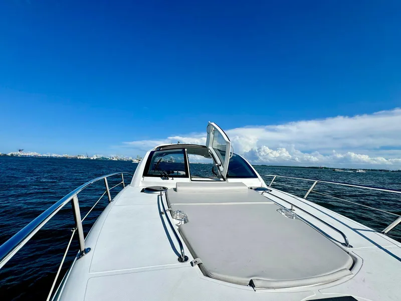 Slide: The Image of 2023 Schaefer 375 yacht cruising on open water under clear blue skies. - 18