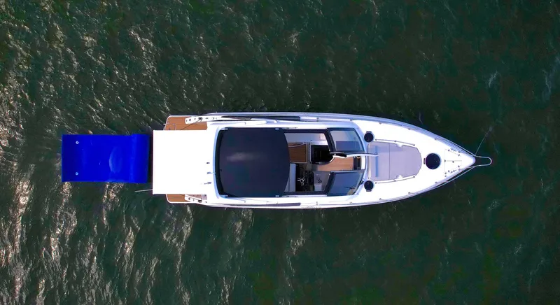 Slide: The Image of Overhead view of 2023 Schaefer 375 yacht on water, featuring sleek design and spacious deck. - 33