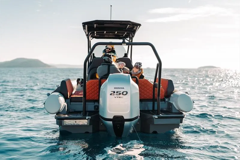 Slide: The Image of 2025 Highfield ADV7 boat with Honda 250 VTEC engine on open water. - 4