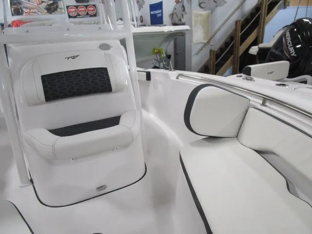 Slide: The Image of 2025 Tidewater 198 CC Adventure boat interior with white seating and modern design. - 10