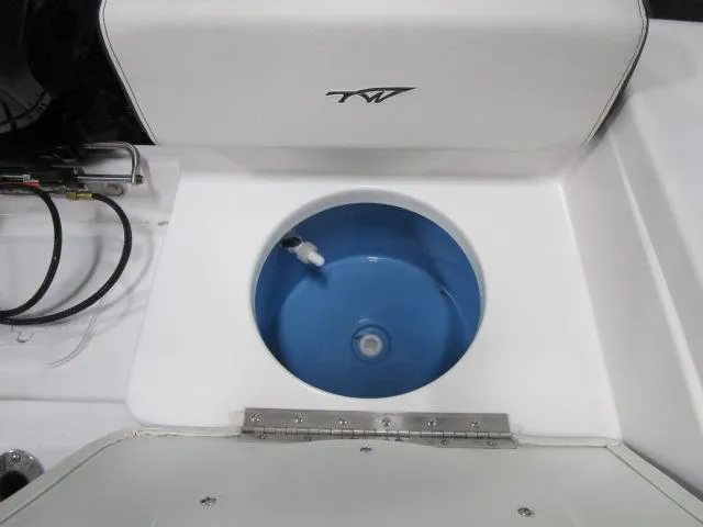 Slide: The Image of Livewell on 2025 Tidewater 198 CC Adventure boat, featuring a blue interior. - 14