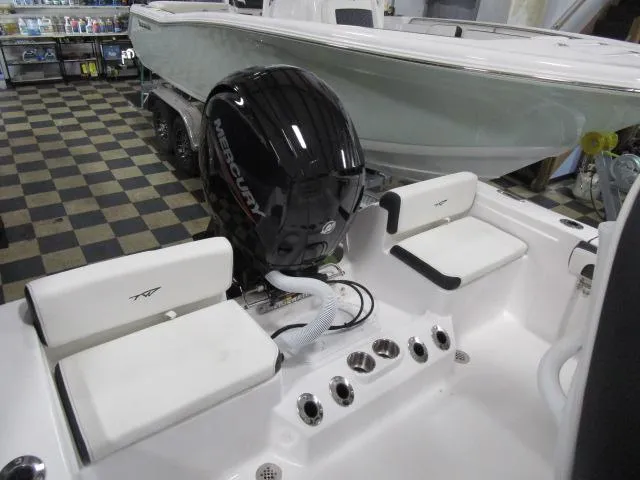 Slide: The Image of 2025 Tidewater 198 CC Adventure boat with Mercury engine in showroom. - 4