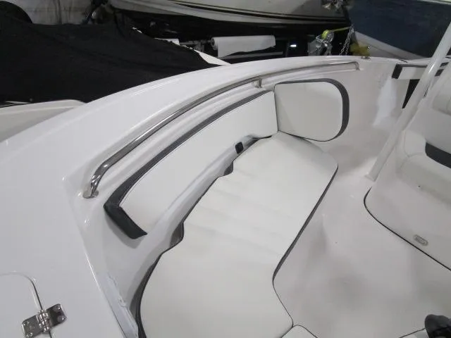 Slide: The Image of 2025 Tidewater 198 CC Adventure boat interior with white cushioned seating. - 7