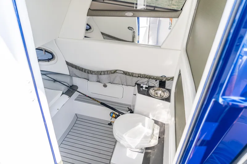 Slide: The Image of 2024 Nor-Tech 390 Sport boat interior with modern bathroom amenities. - 27