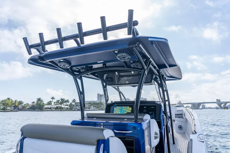 Slide: The Image of 2024 Nor-Tech 390 Sport boat with sleek design on the water. - 7