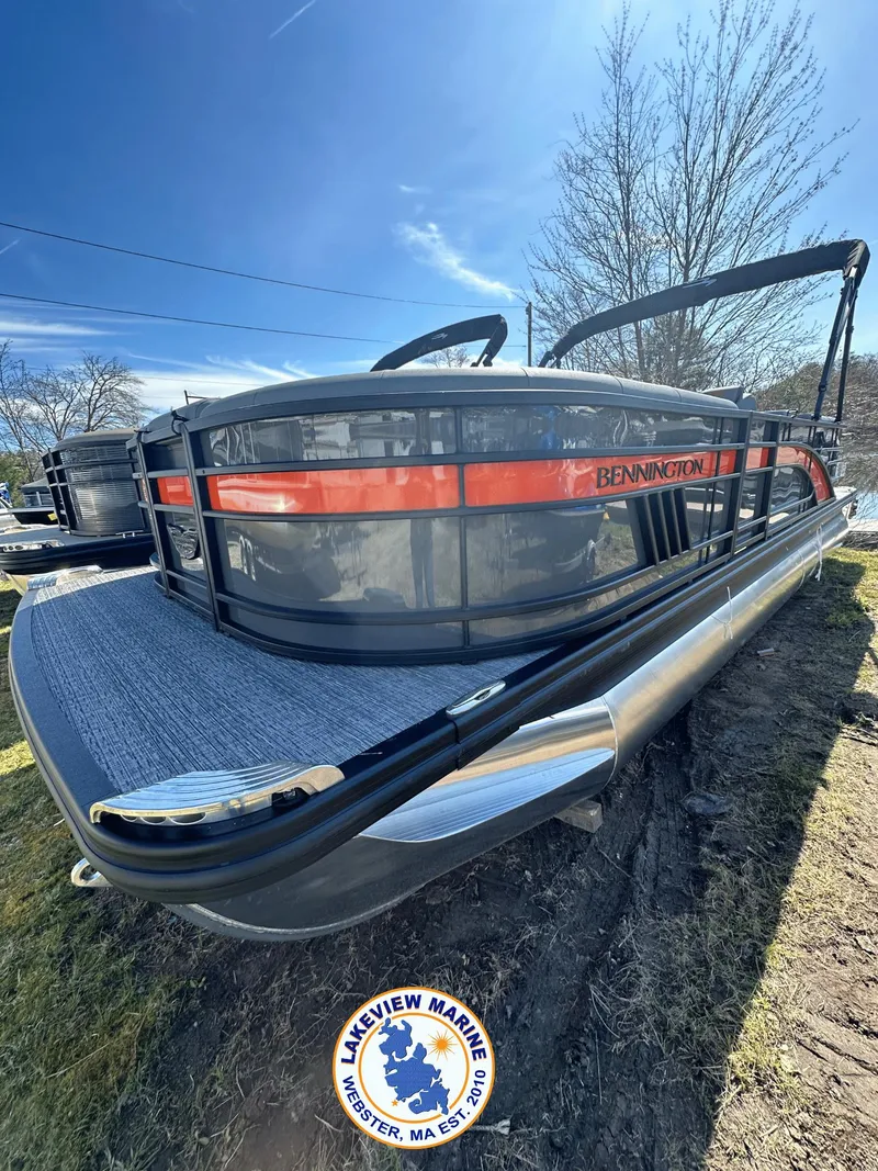 Slide: The Image of 2024 Bennington 23 LSR pontoon boat at Lakeview Marine, sunny day. - 0