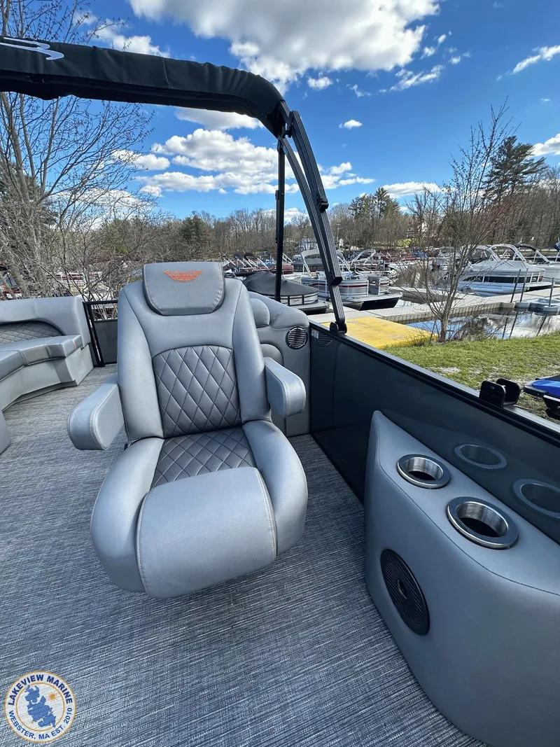 Slide: The Image of 2024 Bennington 23 LSR boat interior with luxurious seating and cup holders. - 7