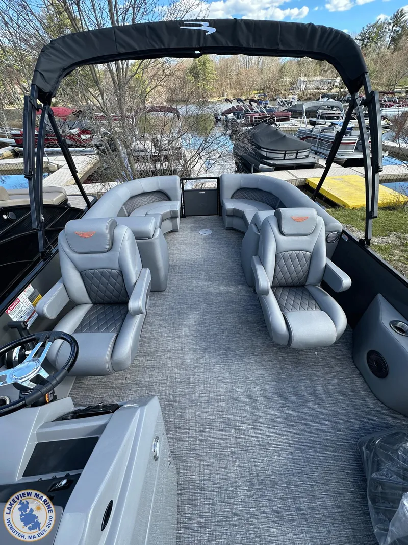 Slide: The Image of 2024 Bennington 23 LSR pontoon boat with luxurious seating and sleek design. - 8