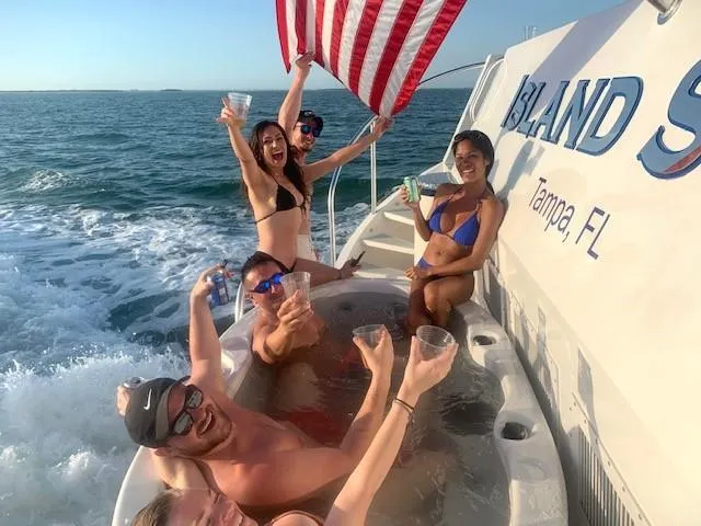 Slide: The Image of Group enjoying a hot tub on a 2009 Custom Flybridge Motoryacht, Tampa, FL. - 3