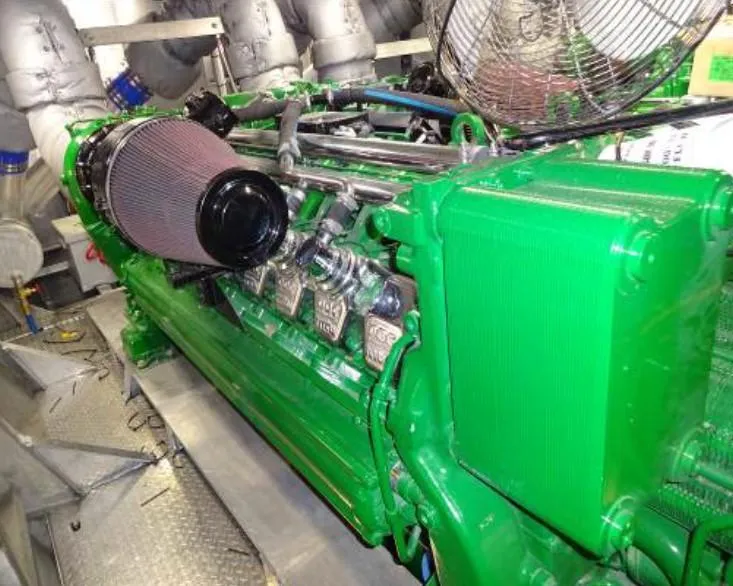 Slide: The Image of Engine of 1981 Midship Marine High Speed Passenger Ferry, painted green, in mechanical room. - 8