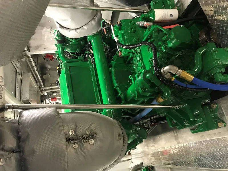 Slide: The Image of Engine room of 1981 Midship Marine High Speed Passenger Ferry, featuring green machinery. - 9