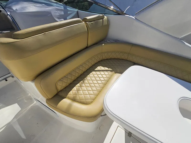 Slide: The Image of Luxurious seating on 2008 Riviera M470 yacht with beige upholstery and quilted design. - 12