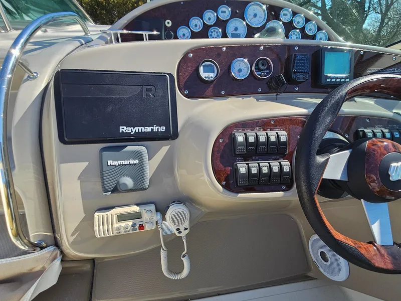 Slide: The Image of Control panel of a 2008 Riviera M470 boat with Raymarine navigation equipment. - 15