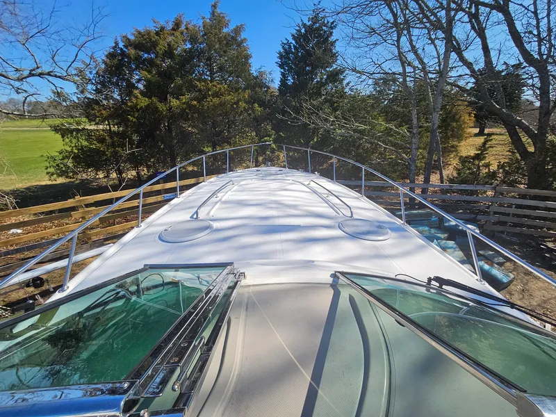 Slide: The Image of 2008 Riviera M470 yacht deck with trees in the background. - 16