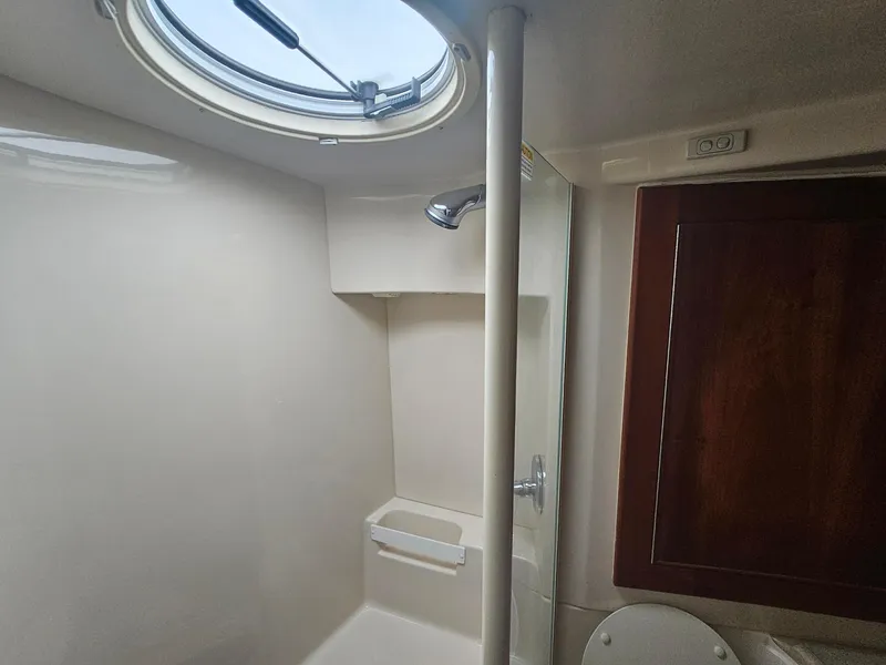 Slide: The Image of Bathroom interior of 2008 Riviera M470 yacht with shower and porthole window. - 23